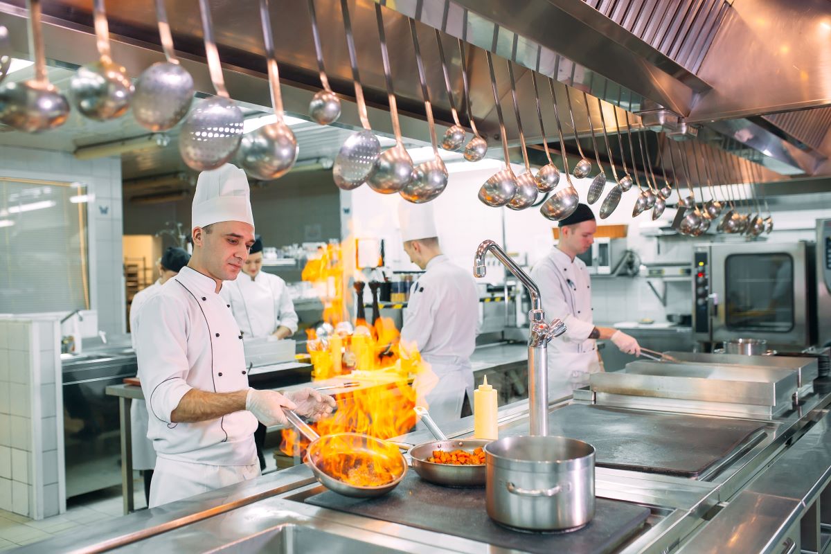 Chef cooking in industrial kitchen