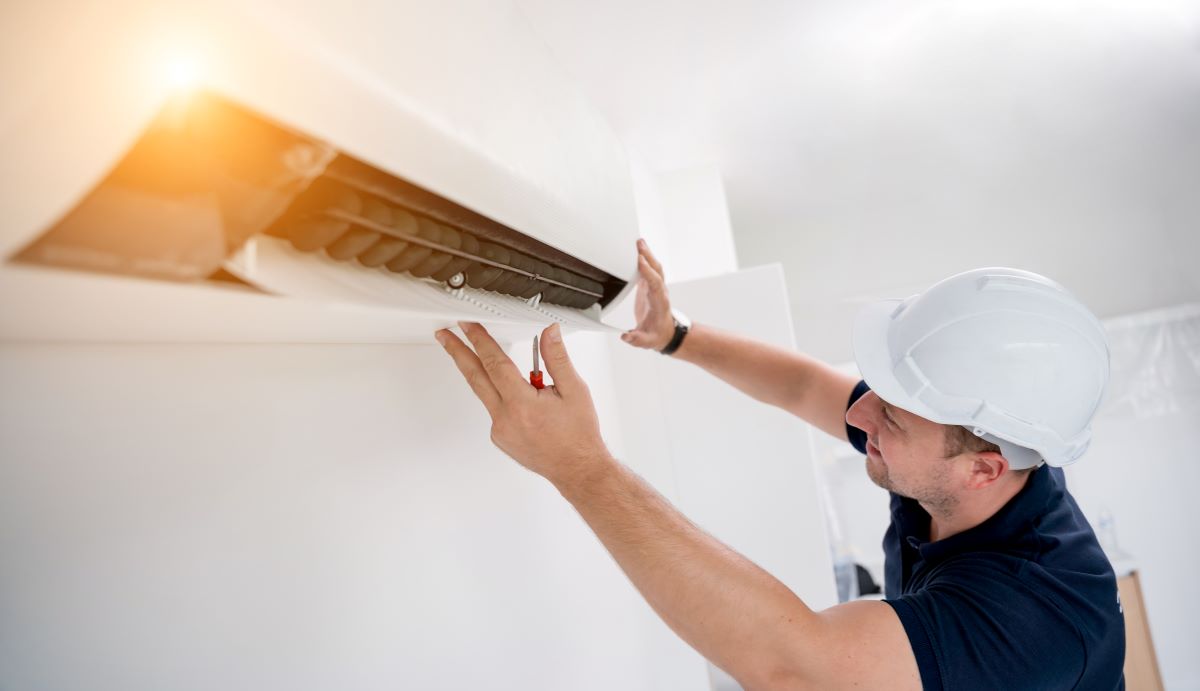 Tech working on ductless ac unit